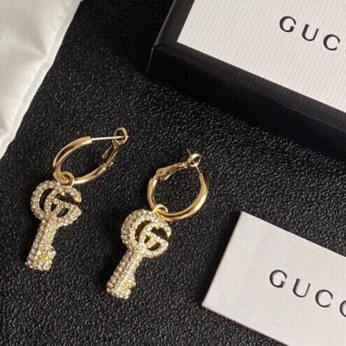 G*u*i earrings